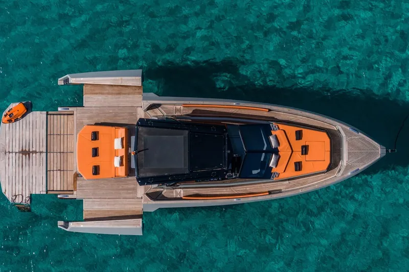 Mistral Yacht Photos Pics 2023 Evo Yachts R4 XT luxury yacht on clear turquoise water, aerial view.