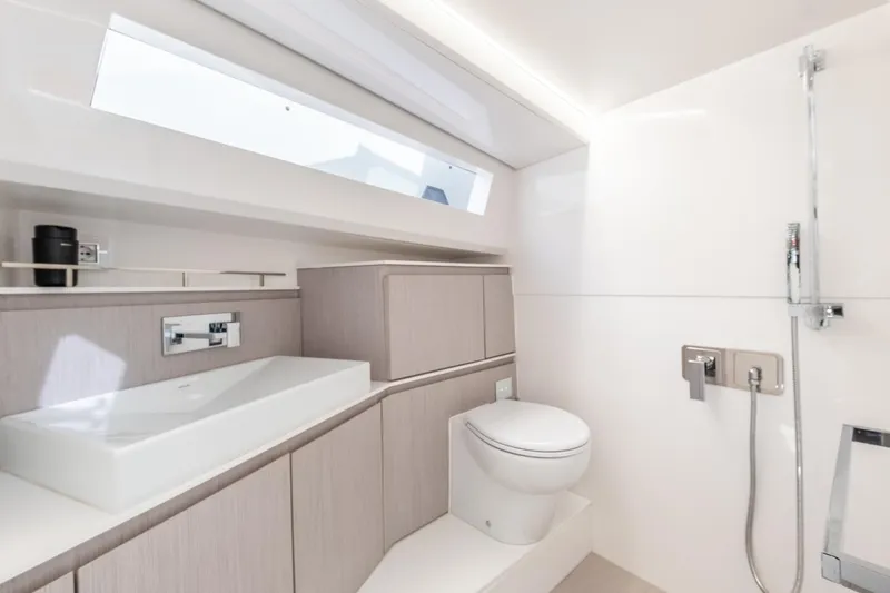 Mistral Yacht Photos Pics Luxurious bathroom in 2023 Evo Yachts R4 XT, featuring modern fixtures and sleek design.