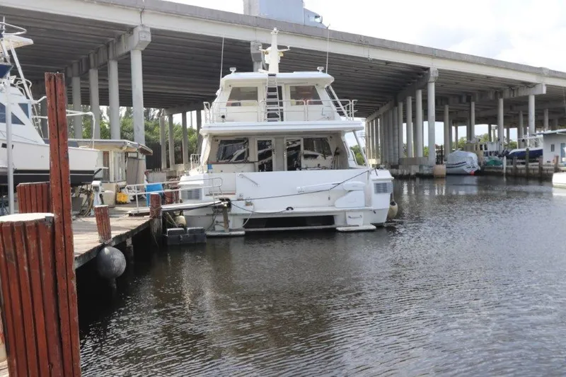  Yacht Photos Pics 1996 Mares Motor Yacht docked at marina under bridge.