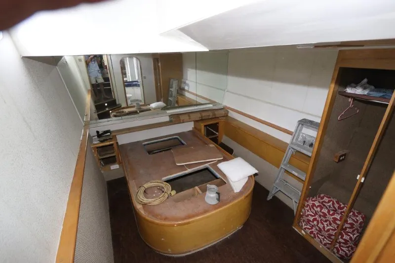  Yacht Photos Pics Interior cabin of a 1996 Mares Motor Yacht with bed and storage space.