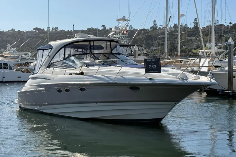  Yacht Photos Pics 2003 Regal Commodore 4260 yacht for sale, docked in marina, sunny day.