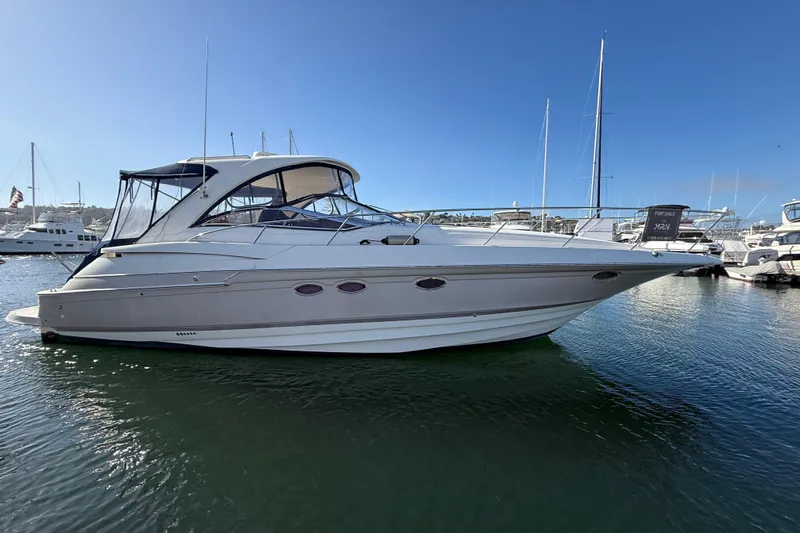  Yacht Photos Pics 2003 Regal Commodore 4260 yacht docked in marina, clear blue sky background.