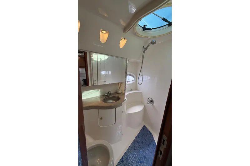  Yacht Photos Pics Bathroom interior of 2003 Regal Commodore 4260 yacht with shower and sink.