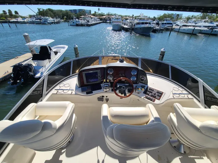  Yacht Photos Pics Helm of 2006 Sea Ray 44 Sedan Bridge yacht with marina view.