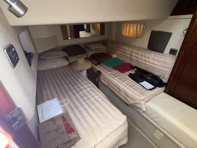  Yacht Photos Pics 2006 Sea Ray 44 Sedan Bridge cabin interior with twin beds and cozy decor.