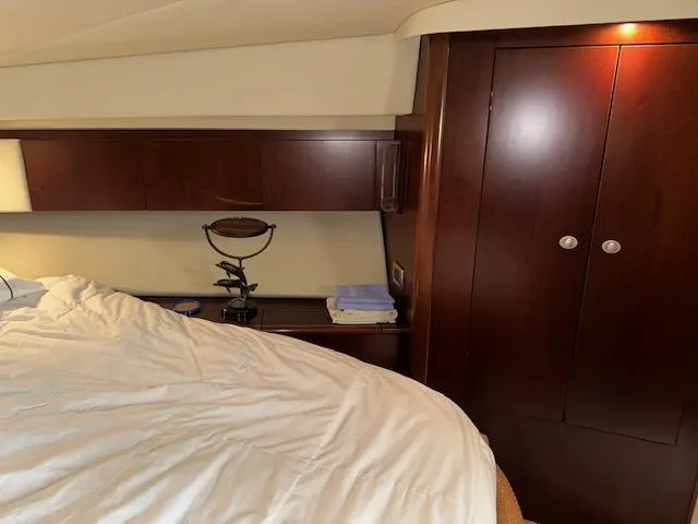  Yacht Photos Pics Interior cabin of 2006 Sea Ray 44 Sedan Bridge with wooden cabinetry and bed.