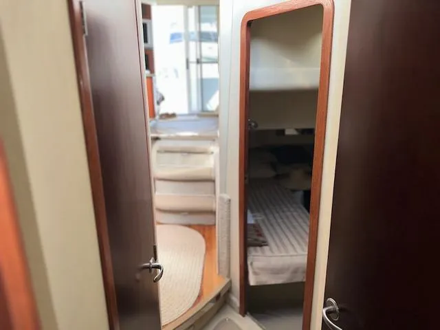  Yacht Photos Pics Interior view of 2006 Sea Ray 44 Sedan Bridge yacht, featuring cozy cabin and modern design.