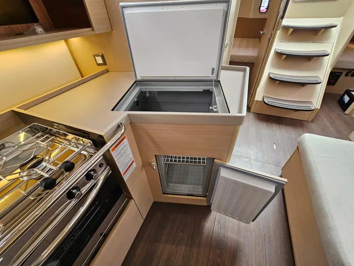  Yacht Photos Pics Modern kitchen in 2024 Beneteau Oceanis 40.1 yacht with stove and fridge.