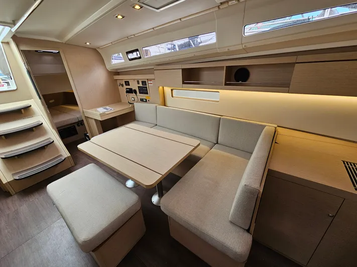  Yacht Photos Pics 2024 Beneteau Oceanis 40.1 interior with modern seating and dining area.