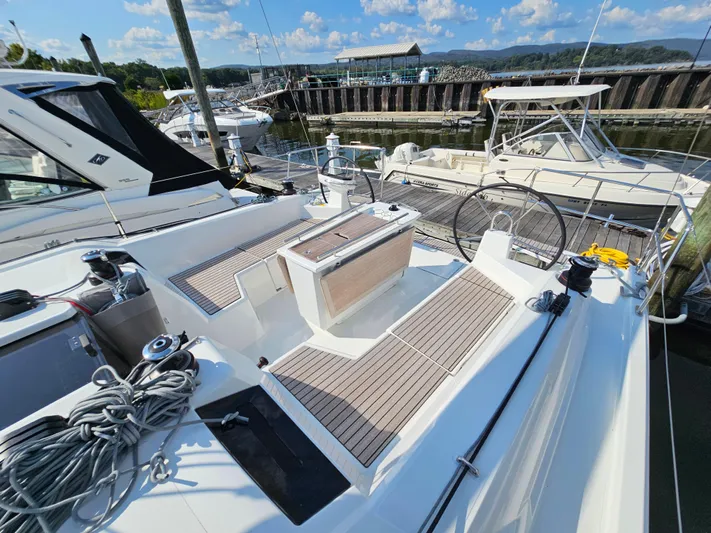  Yacht Photos Pics 2024 Beneteau Oceanis 40.1 sailboat docked, showcasing spacious deck and modern design.