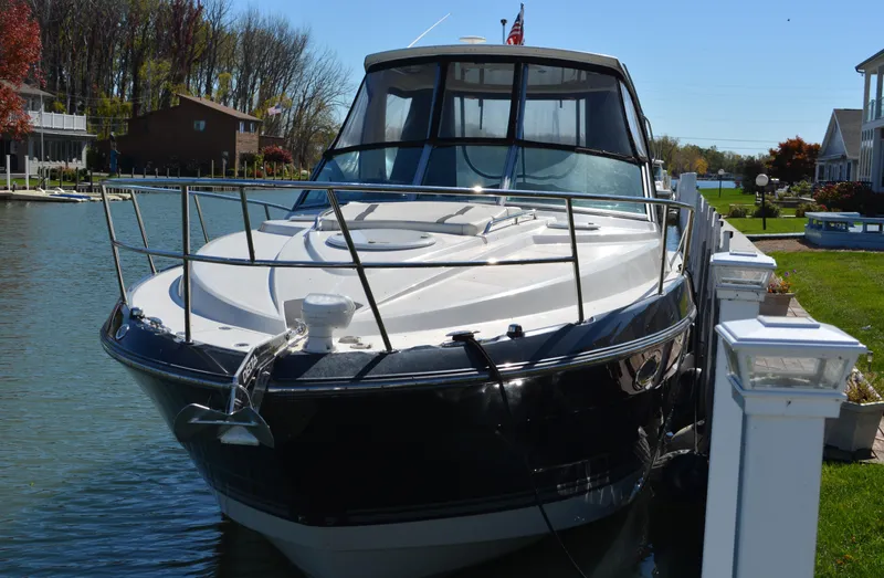 Ruff Life Yacht Photos Pics 2013 Monterey 340 Sport Yacht docked in a scenic waterfront setting.