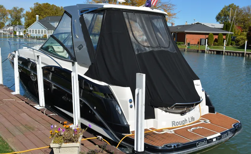 Ruff Life Yacht Photos Pics 2013 Monterey 340 Sport Yacht docked by waterfront homes.
