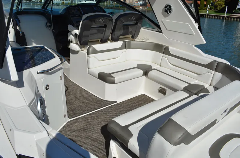 Ruff Life Yacht Photos Pics 2013 Monterey 340 Sport Yacht interior with white and gray seating, sleek design, and waterfront view.