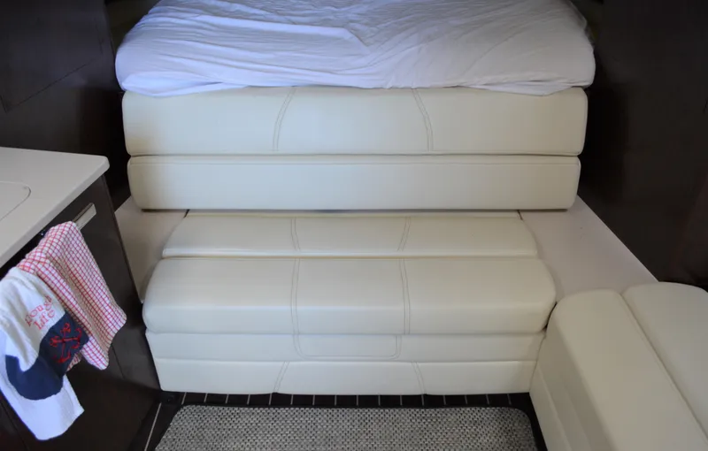Ruff Life Yacht Photos Pics Interior of 2013 Monterey 340 Sport Yacht with cream leather seating and bed.