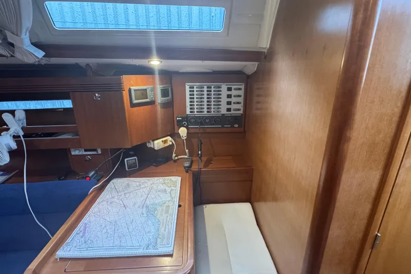 Falcon Yacht Photos Pics Navigation station inside 2004 Dufour 40 Performance yacht with chart and control panel.