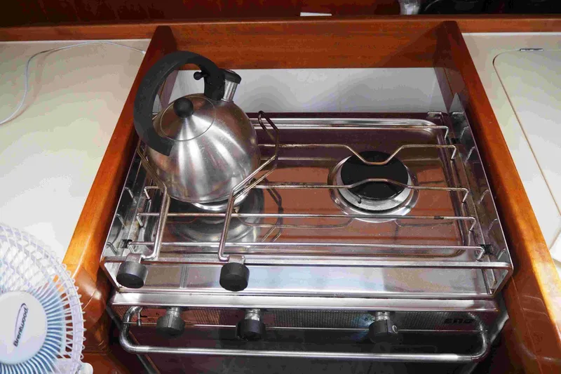 Falcon Yacht Photos Pics Stainless steel kettle on stove in 2004 Dufour 40 Performance yacht kitchen.