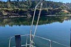 Falcon Yacht Photos Pics Dufour 40 Performance 2004 sailboat on calm water with scenic forested background.