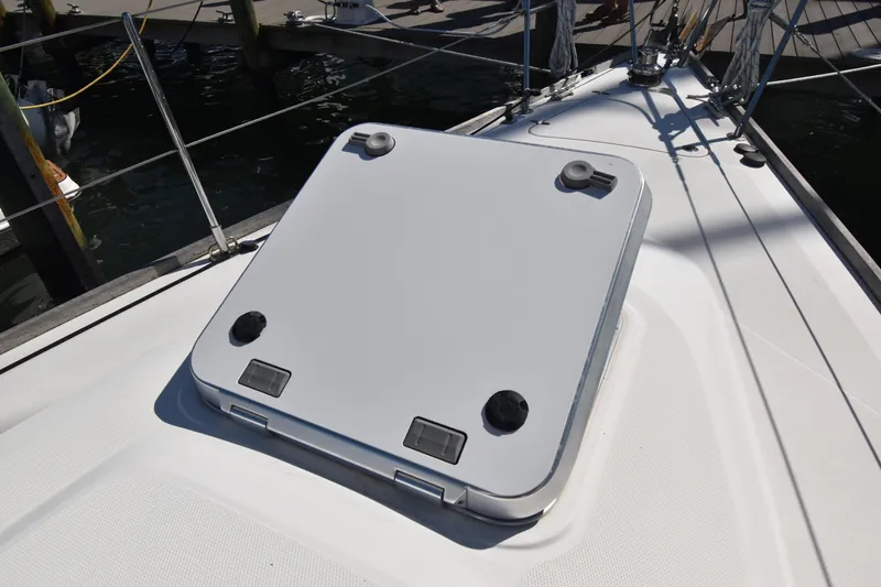 Zia Yacht Photos Pics Deck hatch of a 2004 Sabre 386 sailboat, docked at a marina.