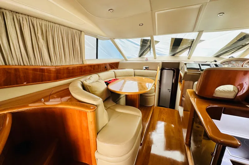  Yacht Photos Pics Luxurious interior of 2001 Princess 56 yacht with elegant wood finish.
