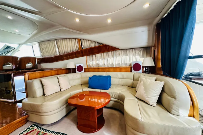  Yacht Photos Pics Luxurious interior of a 2001 Princess 56 yacht with elegant seating and wooden accents.