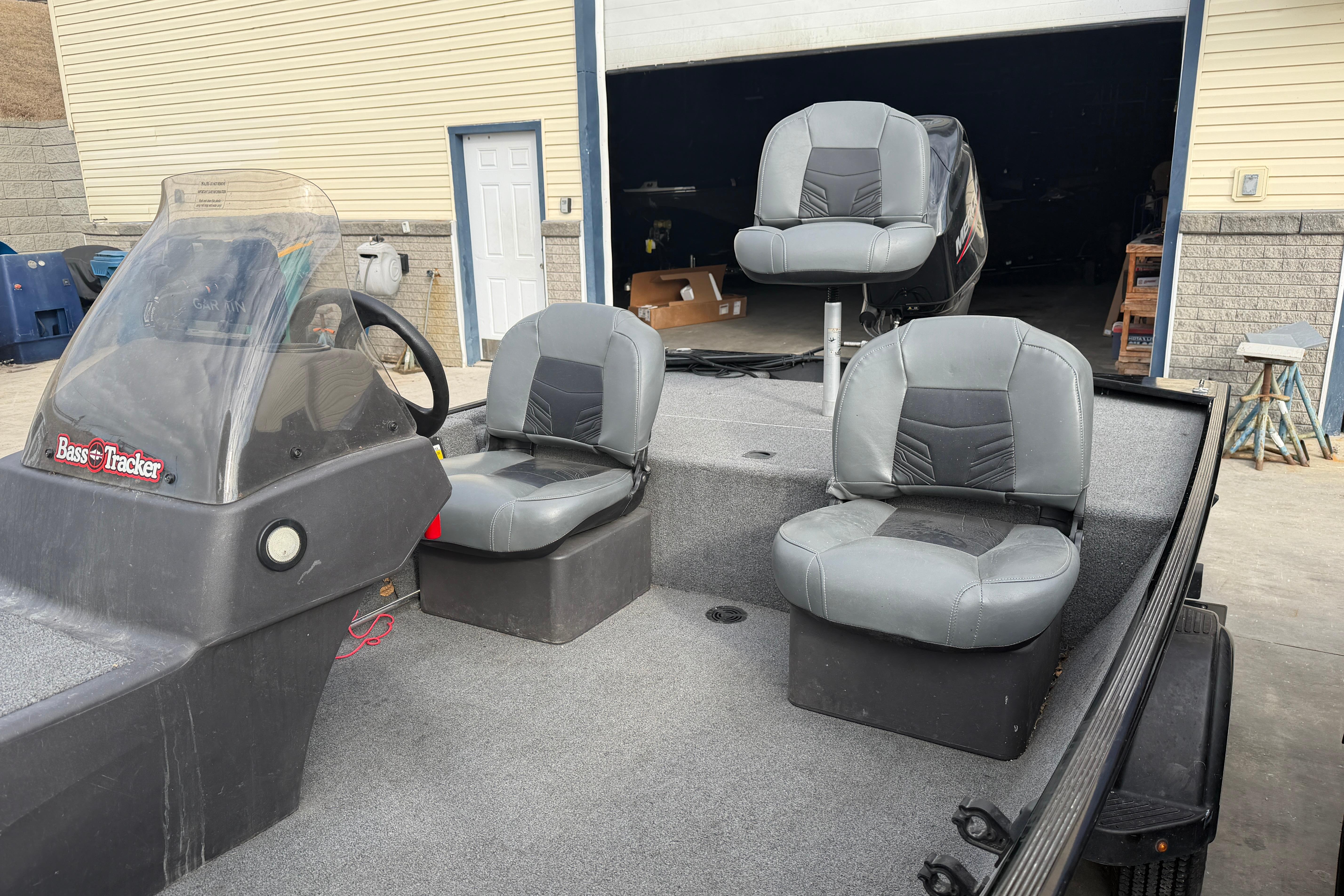 2020 Tracker Bass Tracker Classic XL boat with three gray seats and steering console.