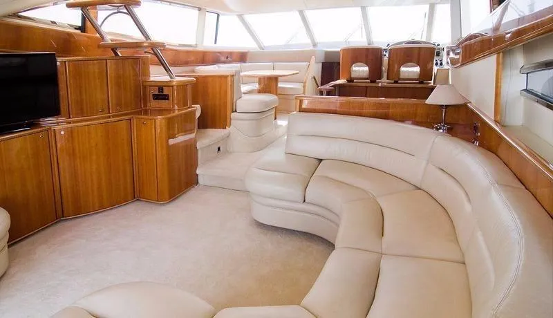  Yacht Photos Pics Luxurious interior of a 2001 Princess 56 yacht with elegant seating and wood finishes.