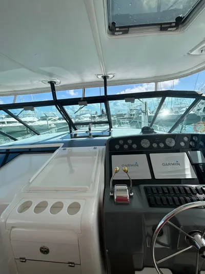  Yacht Photos Pics 2003 Tiara Yachts 4000 Express helm with Garmin navigation, marina view.