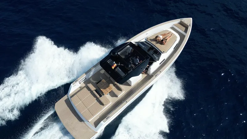 Planazo Yacht Photos Pics 2024 Pardo Yachts P43 cruising on open water, aerial view.