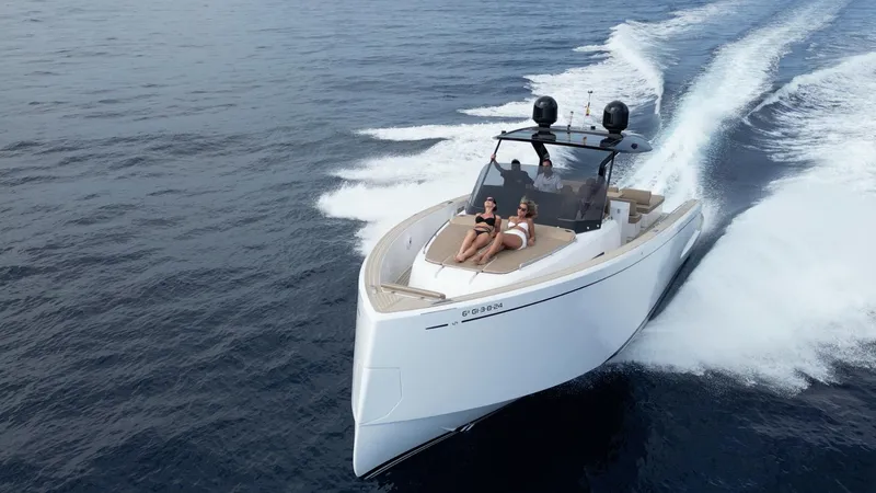 Planazo Yacht Photos Pics 2024 Pardo Yachts P43 cruising on open water with passengers relaxing on deck.