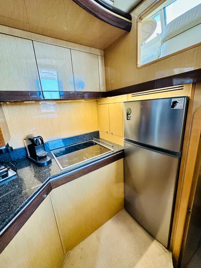  Yacht Photos Pics 2005 Ferretti Yachts 550 kitchen with modern appliances and sleek cabinetry.