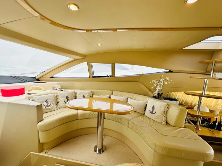  Yacht Photos Pics Luxurious interior of a 2005 Ferretti Yachts 550 with elegant seating and nautical decor.