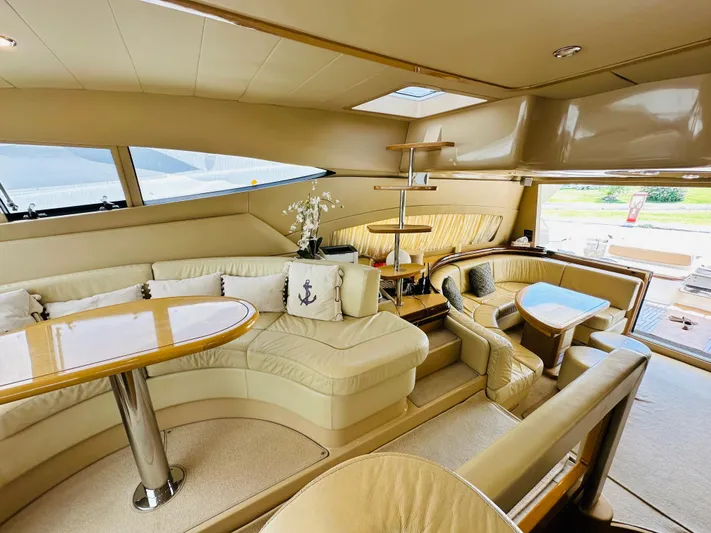  Yacht Photos Pics Luxurious interior of a 2005 Ferretti Yachts 550 with elegant seating and decor.