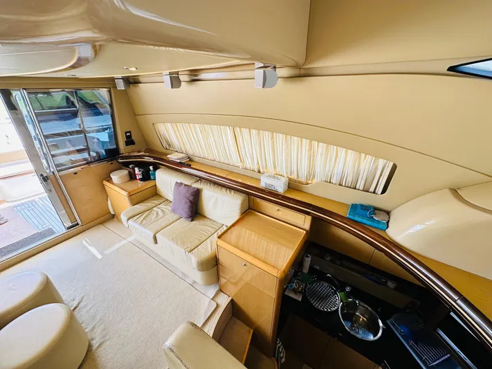  Yacht Photos Pics Luxurious interior of a 2005 Ferretti Yachts 550, featuring elegant seating and modern amenities.