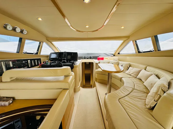  Yacht Photos Pics Luxurious interior of a 2005 Ferretti Yachts 550 with plush seating and modern controls.