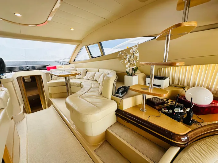  Yacht Photos Pics Luxurious interior of a 2005 Ferretti Yachts 550, featuring elegant seating and modern design.