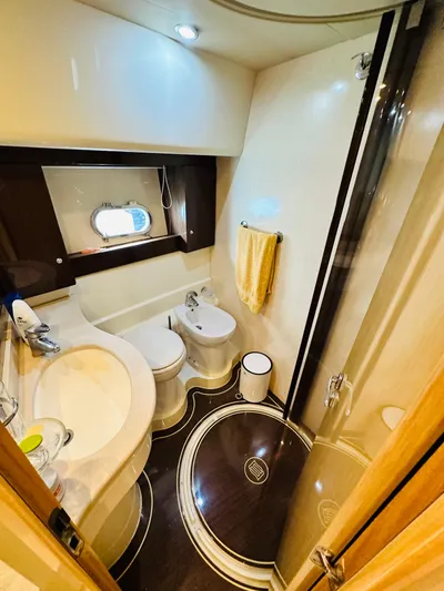  Yacht Photos Pics Luxurious bathroom in 2005 Ferretti Yachts 550, featuring modern fixtures and elegant design.