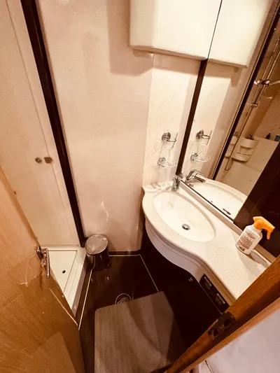  Yacht Photos Pics Bathroom interior of 2005 Ferretti Yachts 550, featuring sink and mirror.