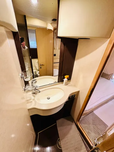  Yacht Photos Pics Luxurious bathroom in a 2005 Ferretti Yachts 550, featuring modern sink and mirror.