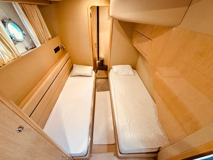  Yacht Photos Pics Twin cabin interior of 2005 Ferretti Yachts 550 with modern design and cozy beds.