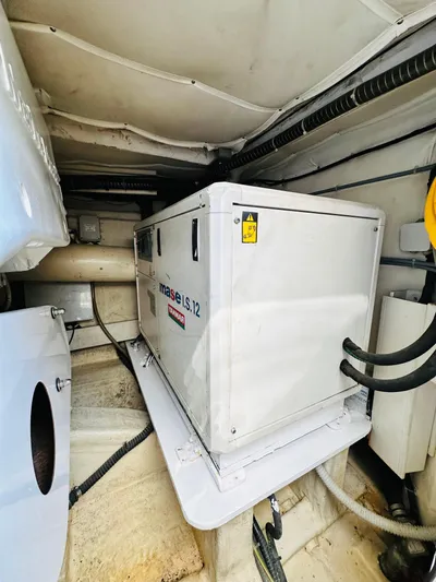  Yacht Photos Pics Engine room of 2005 Ferretti Yachts 550, featuring a Mase IS 12 generator.