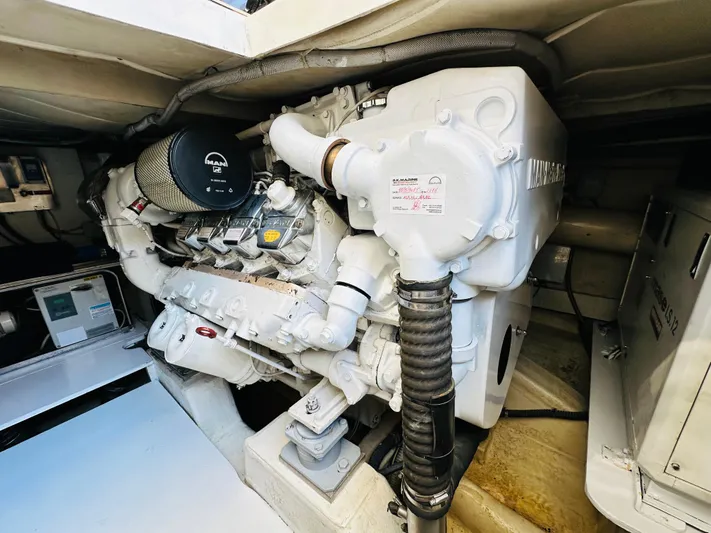  Yacht Photos Pics Engine room of a 2005 Ferretti Yachts 550, showcasing a powerful marine engine.