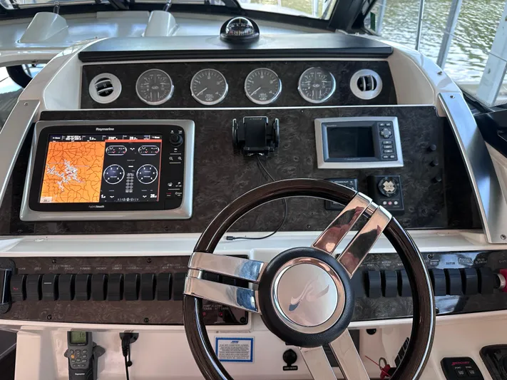  Yacht Photos Pics Helm of 2013 Sea Ray 410 Sundancer with navigation and control instruments.