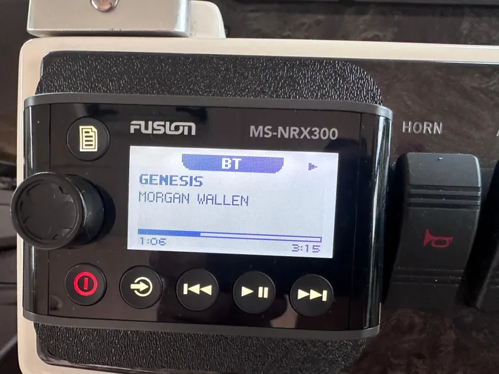  Yacht Photos Pics Fusion MS-NRX300 stereo on 2013 Sea Ray 410 Sundancer displaying song information.