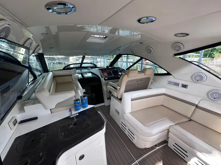  Yacht Photos Pics Interior of 2013 Sea Ray 410 Sundancer yacht with luxurious seating and modern dashboard.