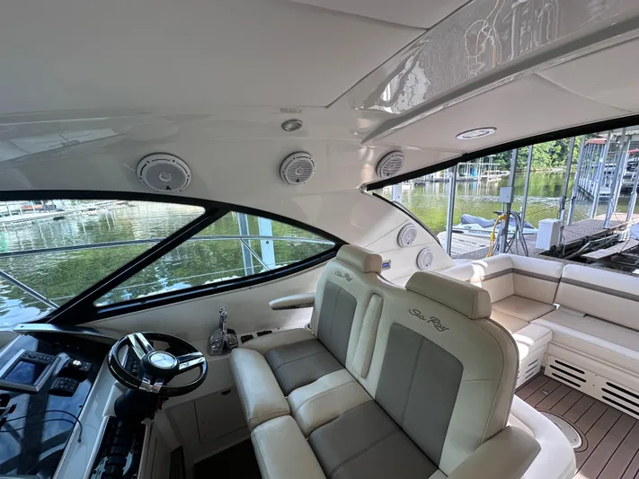  Yacht Photos Pics Interior of 2013 Sea Ray 410 Sundancer yacht with luxurious seating and helm.