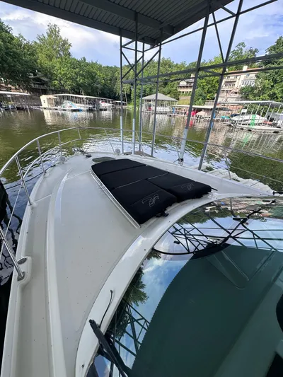  Yacht Photos Pics 2013 Sea Ray 410 Sundancer docked at a marina with scenic waterfront view.