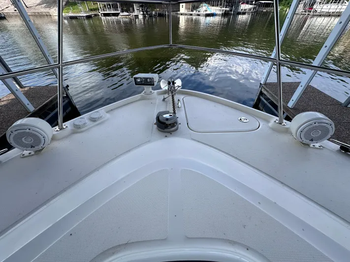  Yacht Photos Pics Bow view of 2013 Sea Ray 410 Sundancer yacht at dock, featuring speakers and railing.