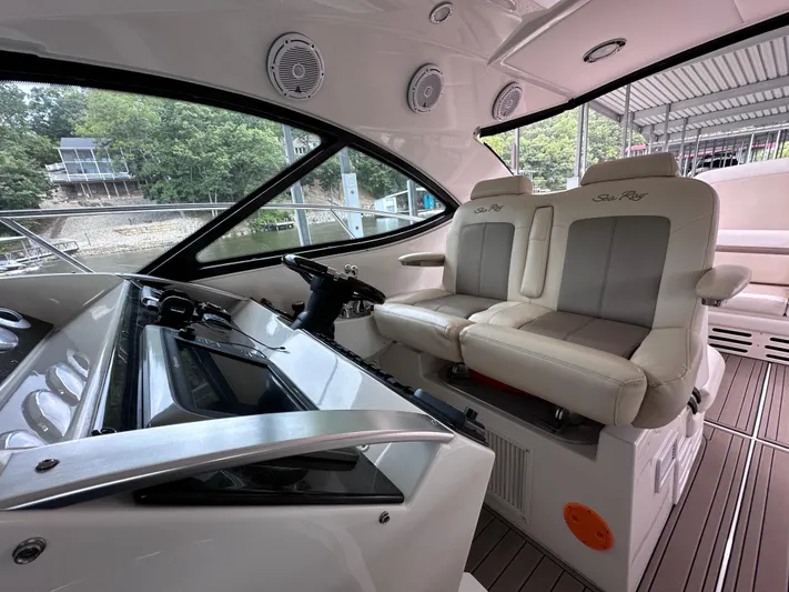  Yacht Photos Pics Interior of 2013 Sea Ray 410 Sundancer yacht with helm and seating area.