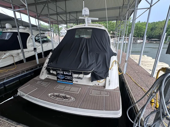  Yacht Photos Pics 2013 Sea Ray 410 Sundancer yacht for sale, docked under a covered marina.