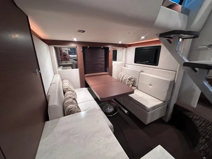  Yacht Photos Pics Luxurious interior of 2013 Sea Ray 410 Sundancer yacht with elegant seating and modern design.